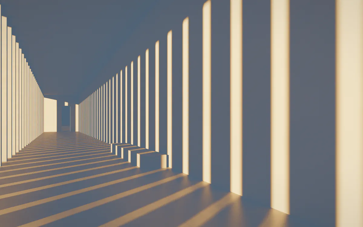 Contemporary gallery with stone floor and warm light falling between tall fins
